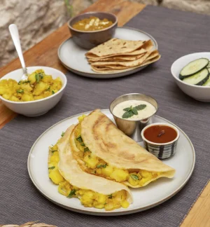 Masala dosa with chutneys and sambar